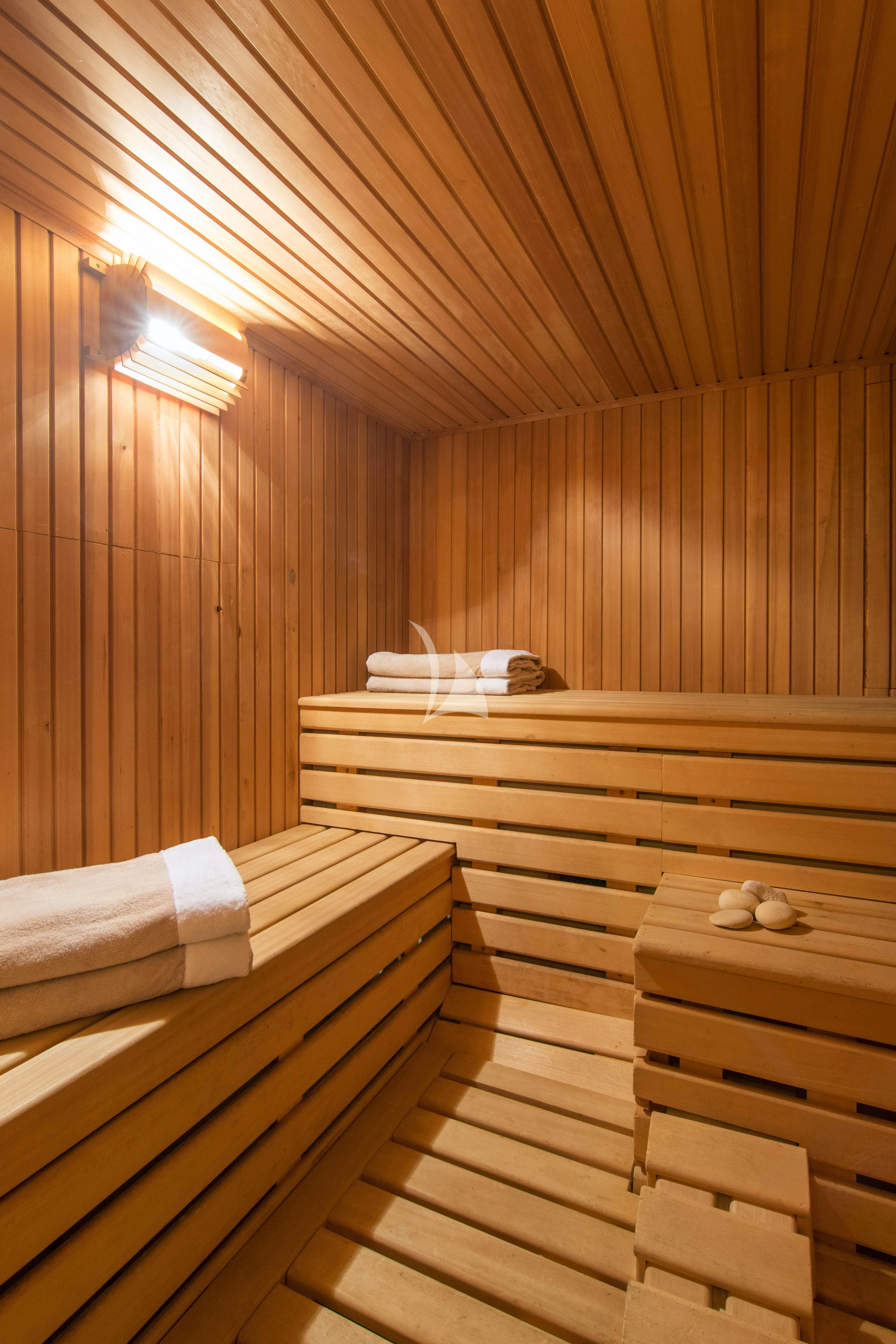 a wooden sauna with wooden walls aboard XASTERIA Yacht for Charter