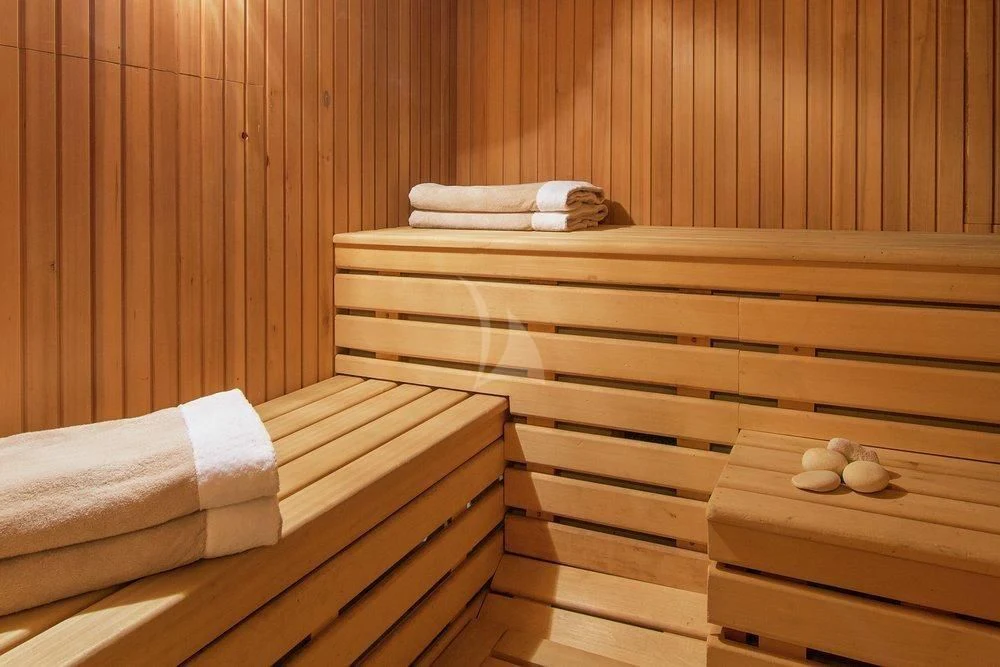 a group of white towels on a wooden surface aboard XASTERIA Yacht for Charter