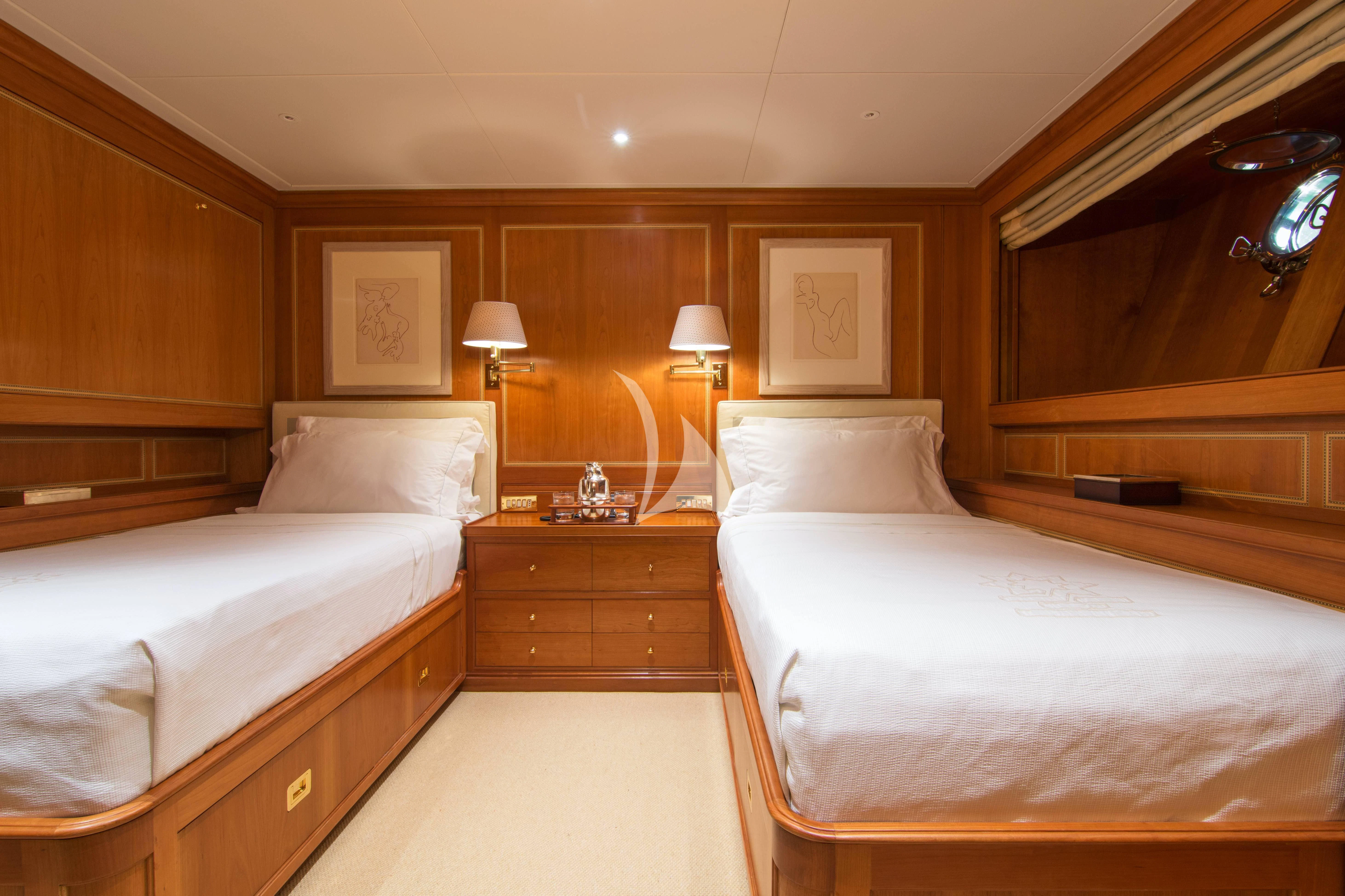 a room with two beds aboard XASTERIA Yacht for Charter