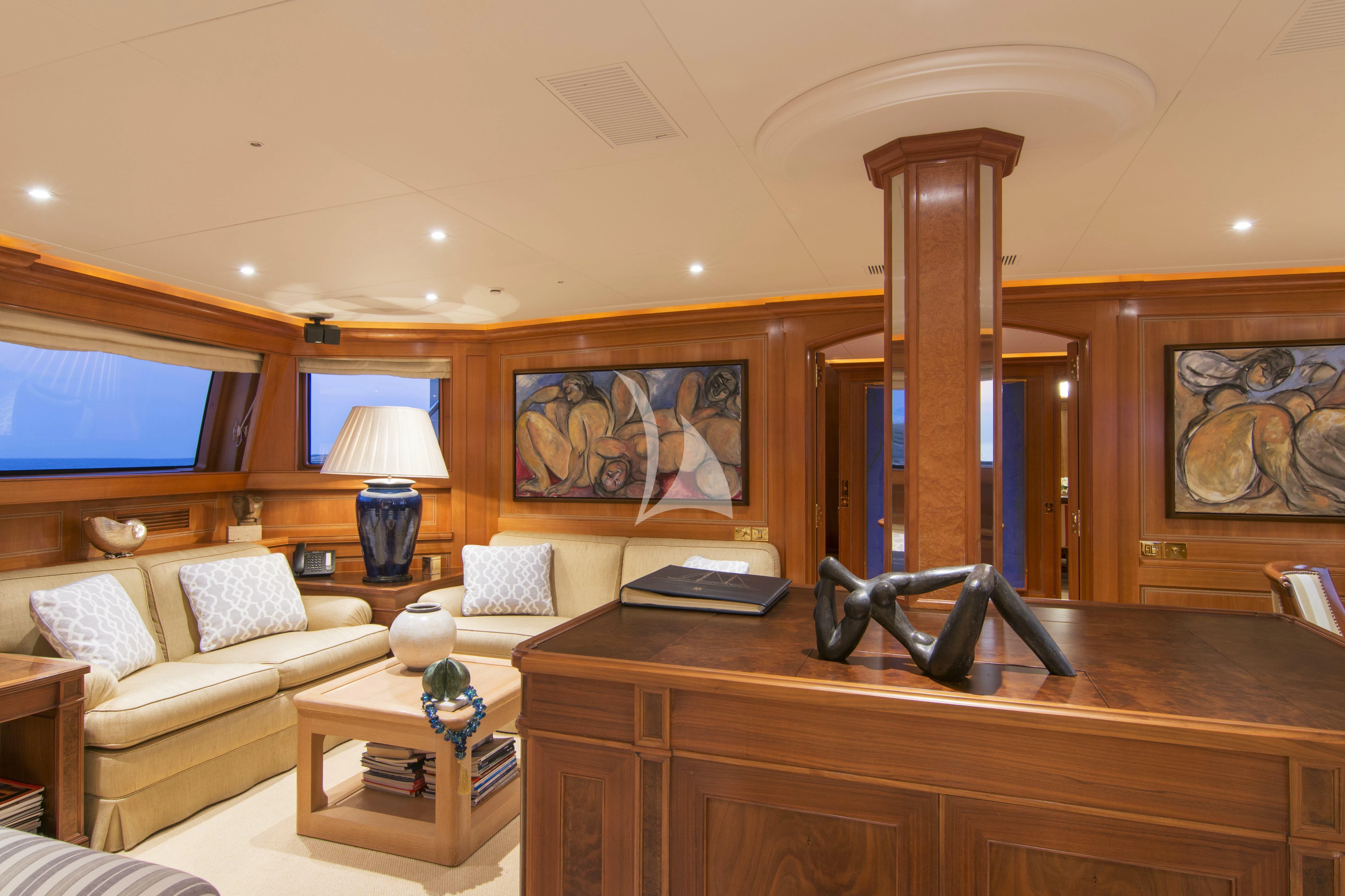 a living room with a large mirror aboard XASTERIA Yacht for Charter