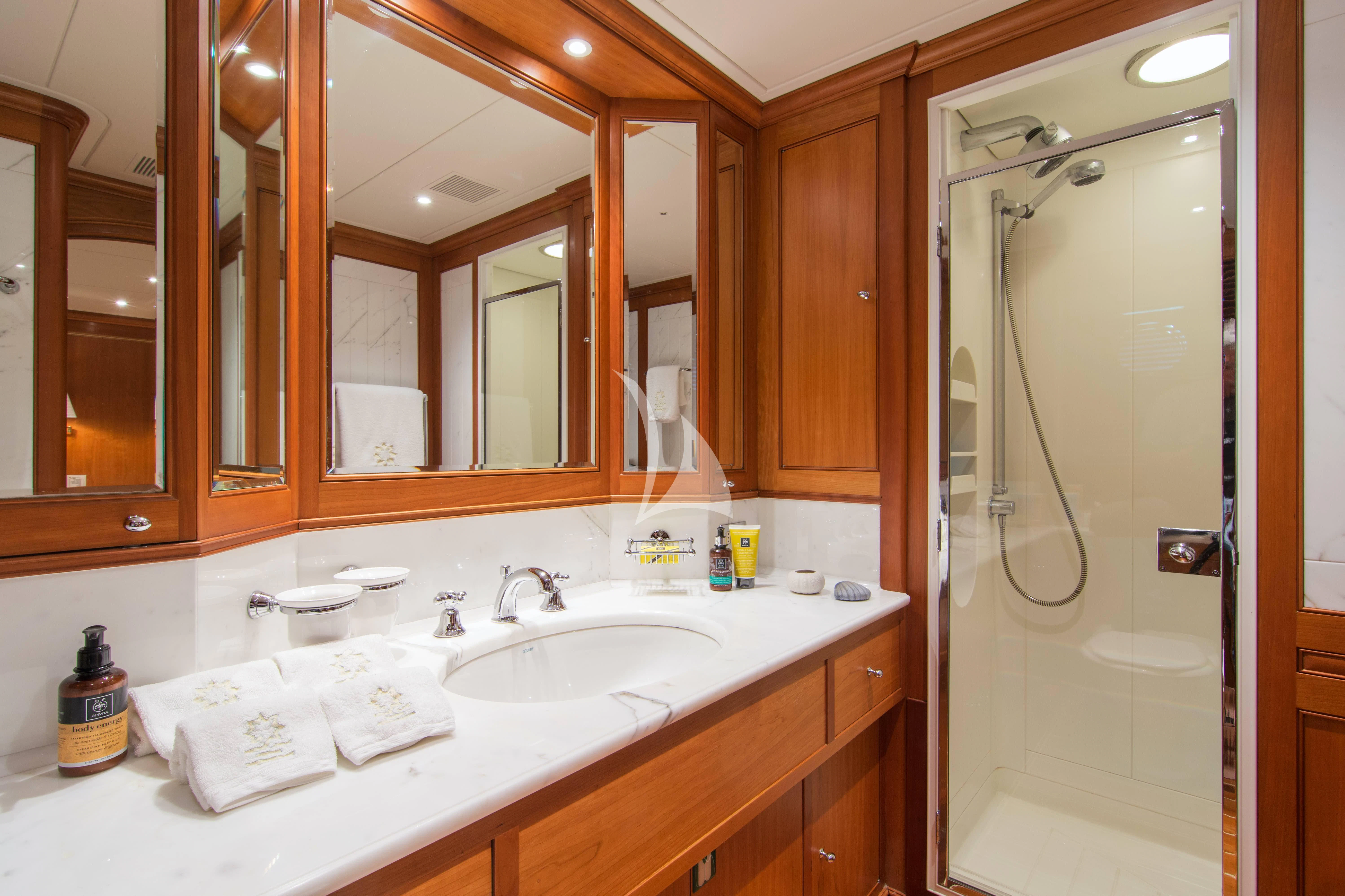 a bathroom with a shower and sink aboard XASTERIA Yacht for Charter