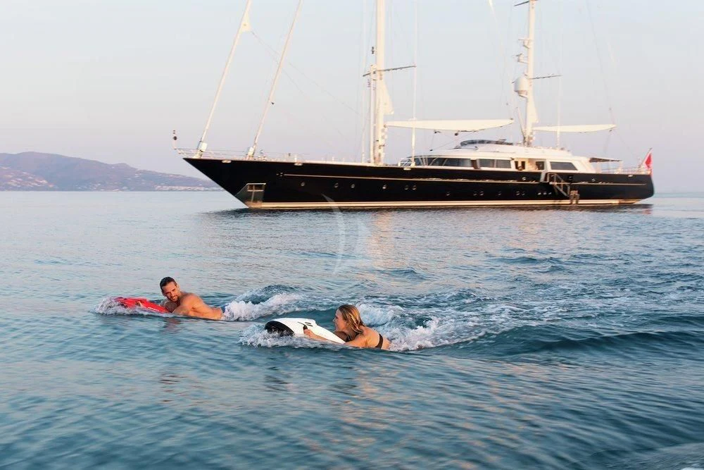 a man and woman in the water aboard XASTERIA Yacht for Charter