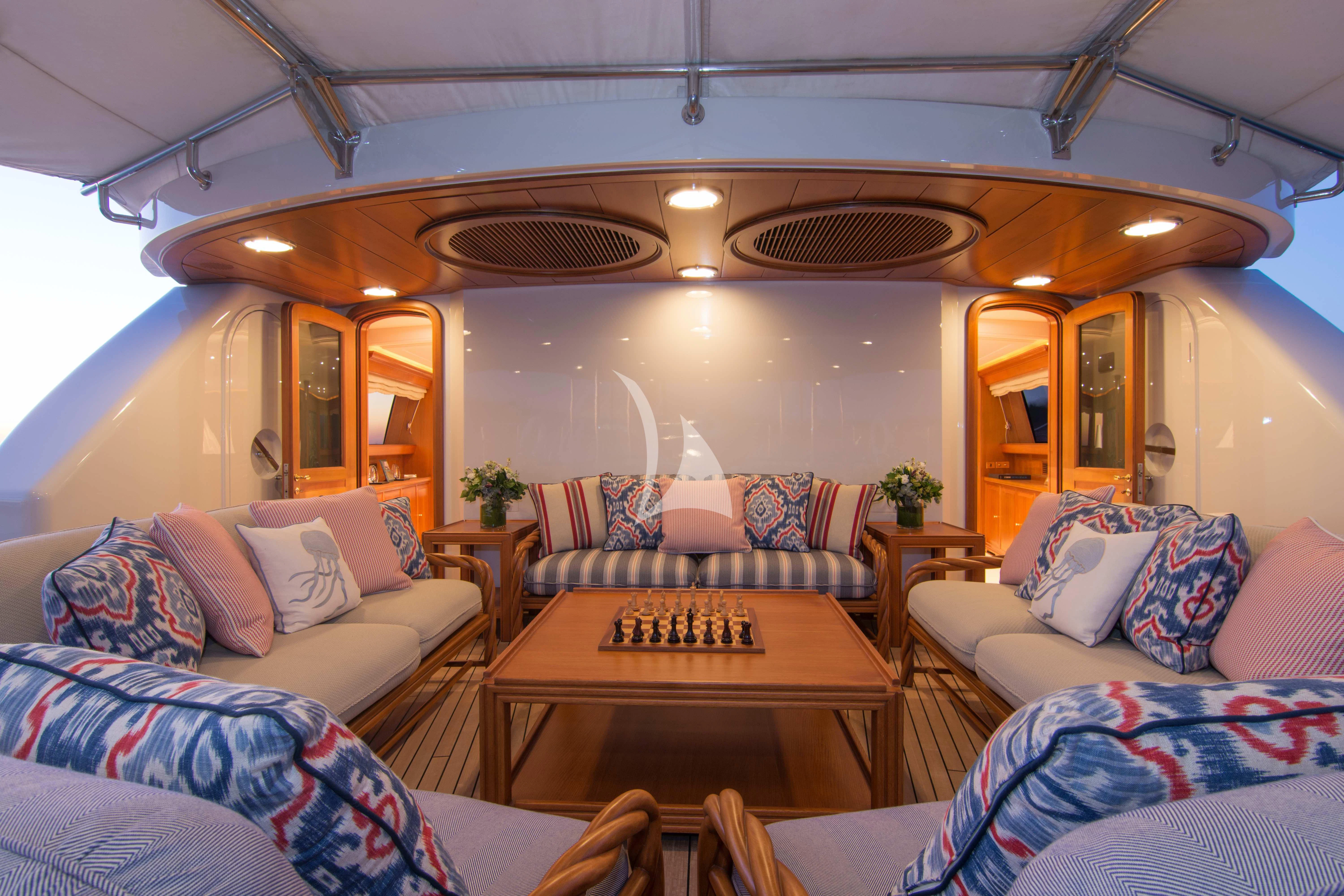 a living room with a couch and a table aboard XASTERIA Yacht for Charter