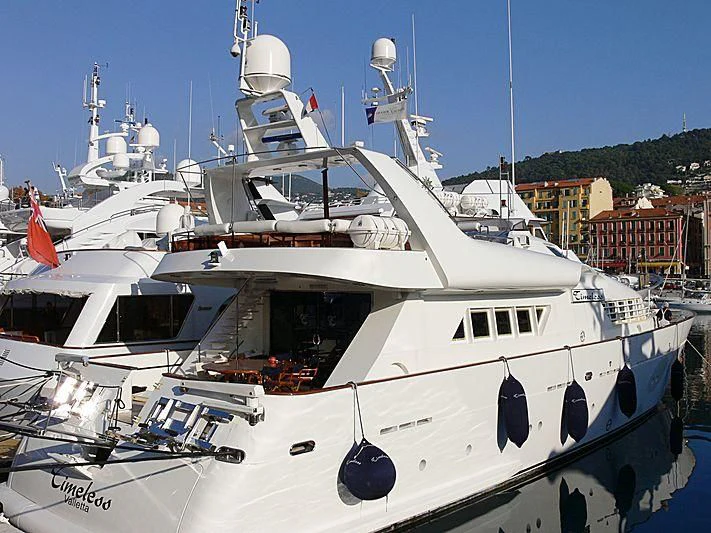 a white boat with black spots aboard AN Yacht for Sale