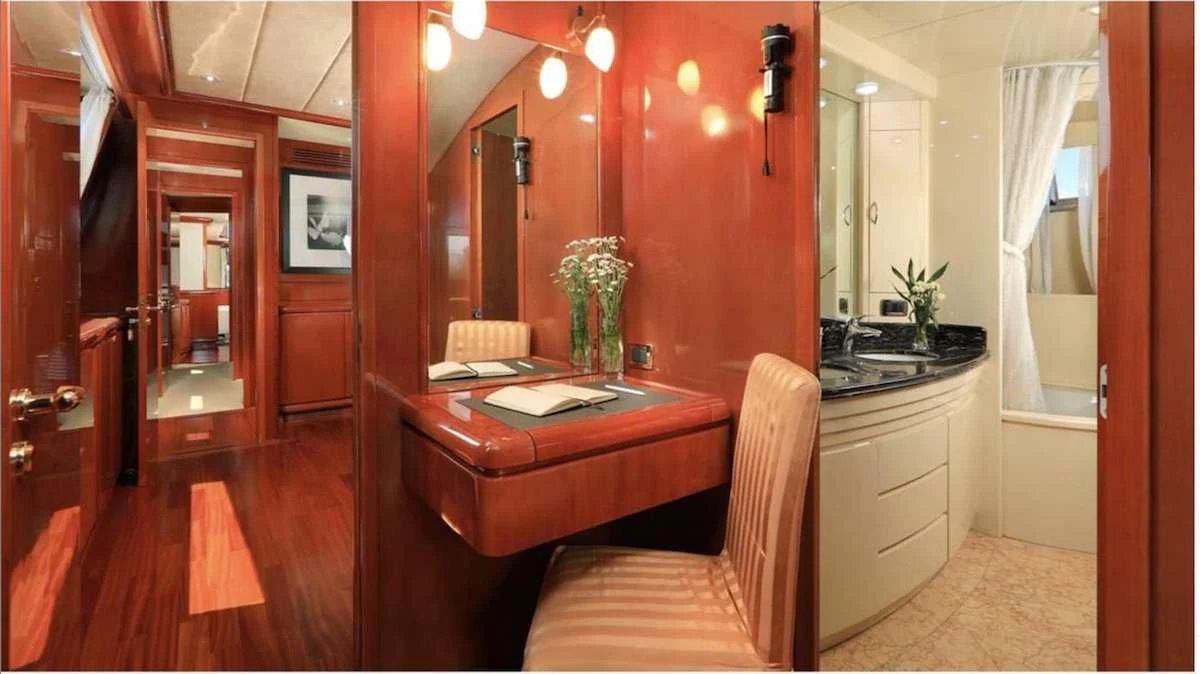 a bathroom with a sink and a mirror aboard DEMAREST Yacht for Sale