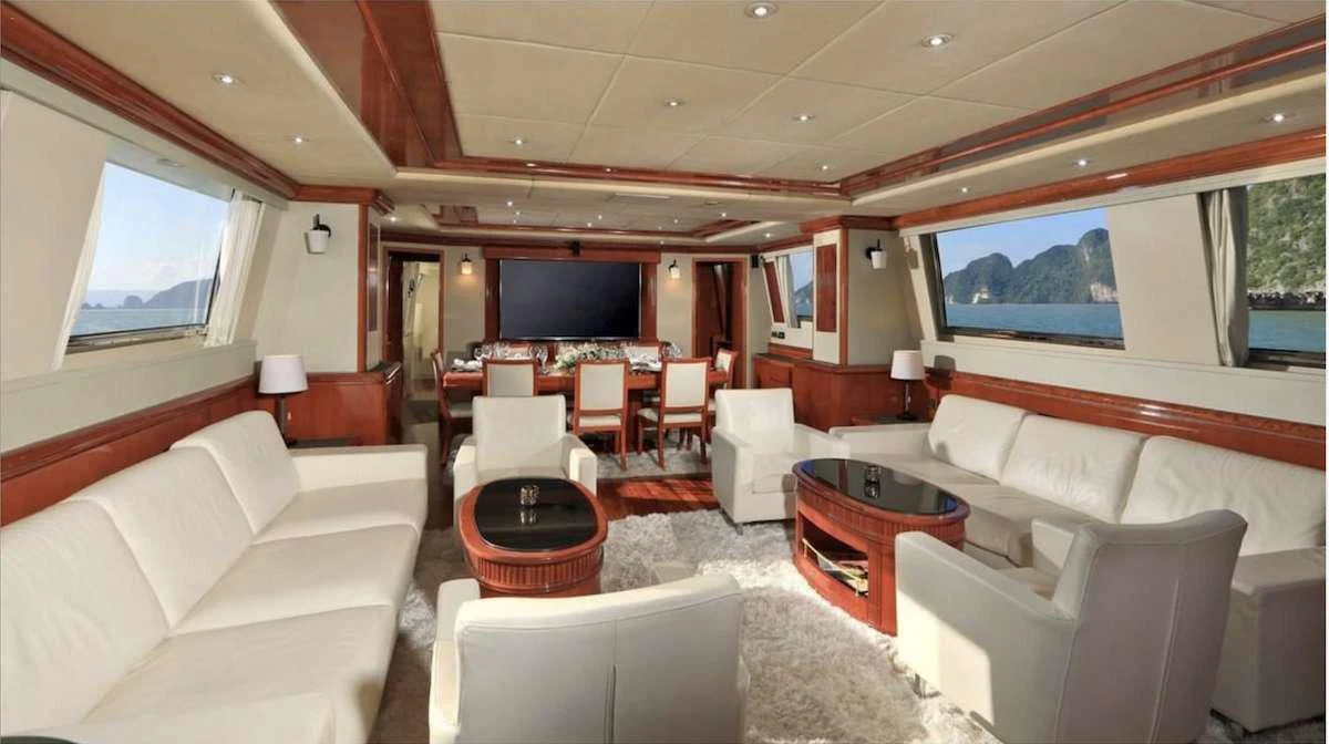 a living room with a large screen aboard DEMAREST Yacht for Sale