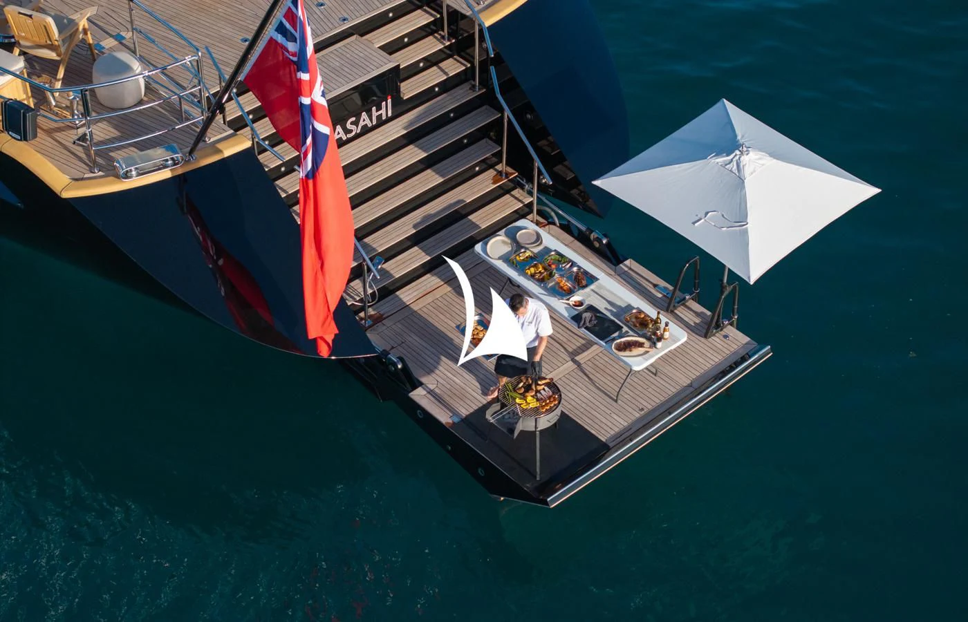 a boat with a couple of people on it aboard ASAHI Yacht for Sale