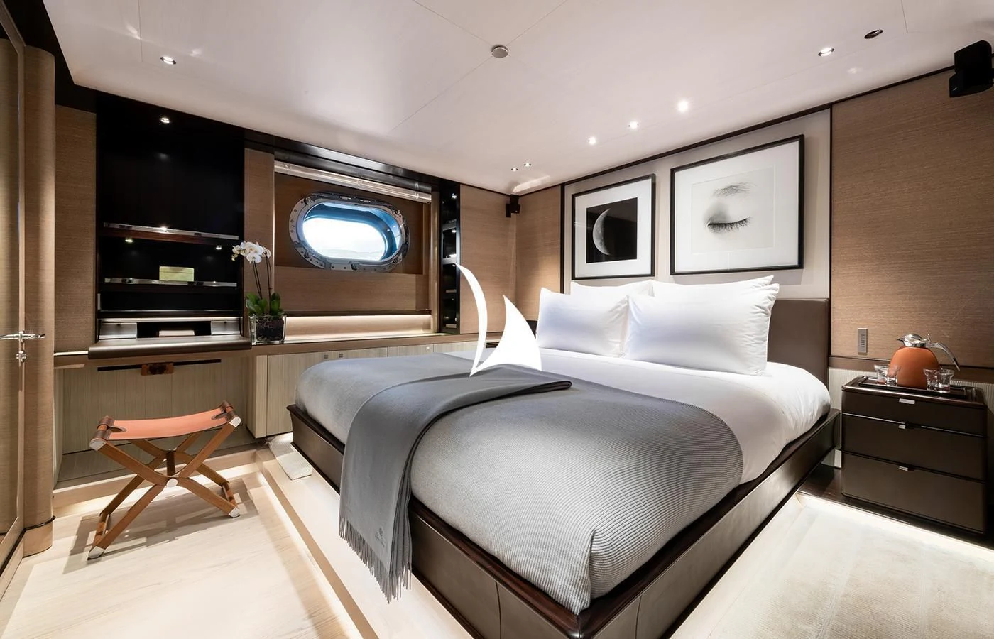 a bedroom with a bed and a television aboard ASAHI Yacht for Sale