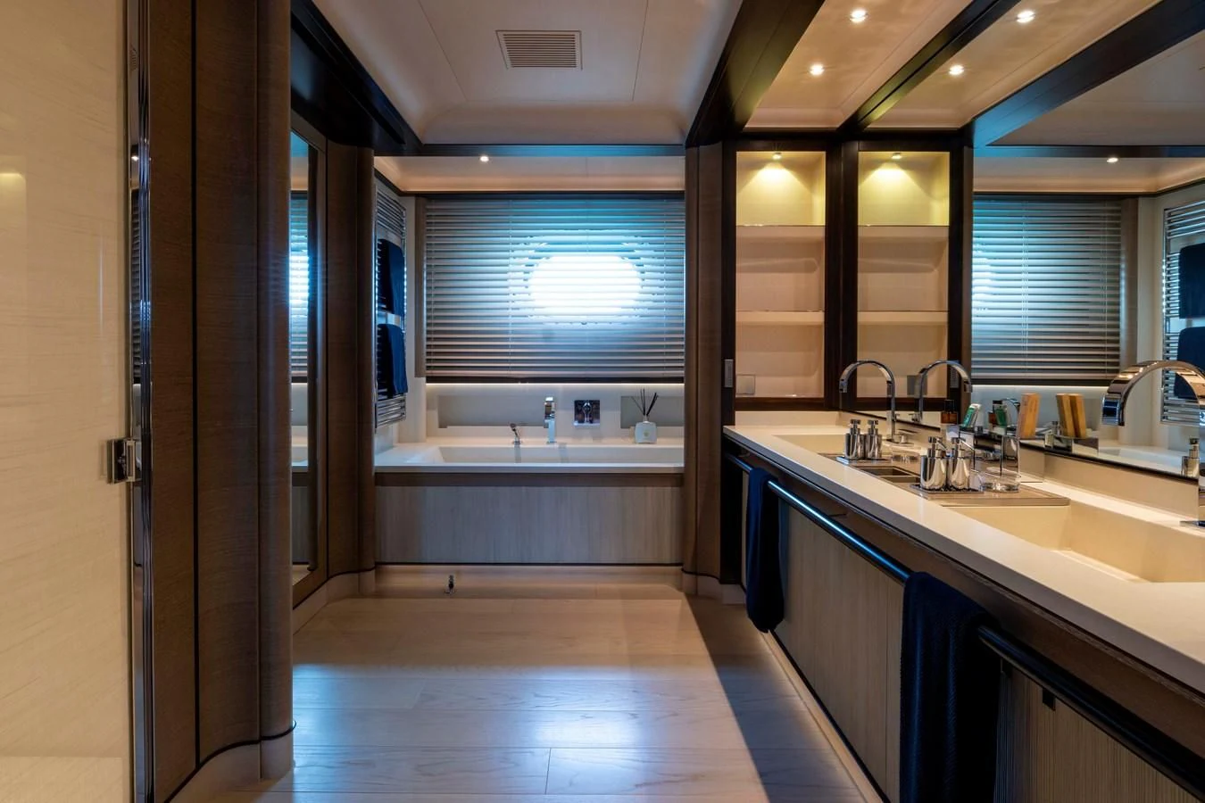 a bathroom with a large mirror aboard ASAHI Yacht for Sale
