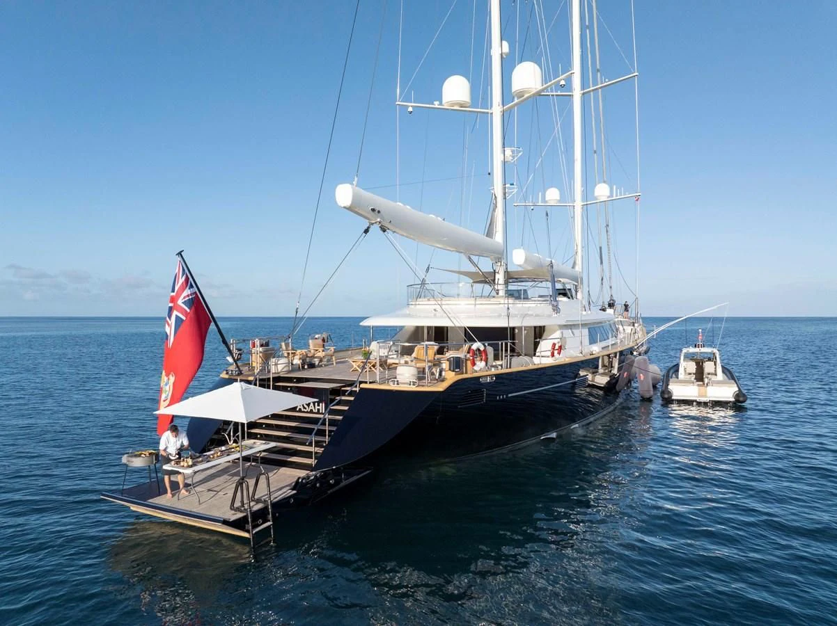 a boat with a flag on it aboard ASAHI Yacht for Sale