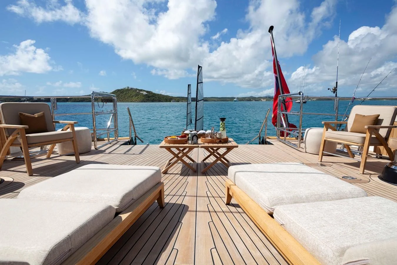 a deck with a view of the ocean and a boat on it aboard ASAHI Yacht for Sale