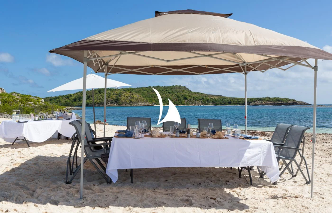 a table and chairs on a beach aboard ASAHI Yacht for Sale