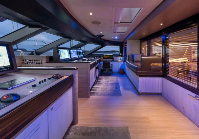 a room with a large counter and a television aboard ASAHI Yacht for Sale
