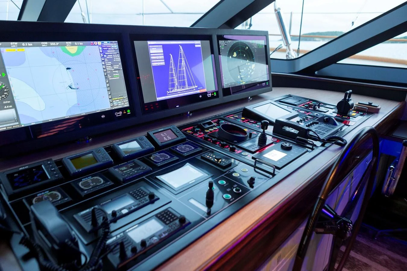 a control panel with multiple monitors aboard ASAHI Yacht for Sale