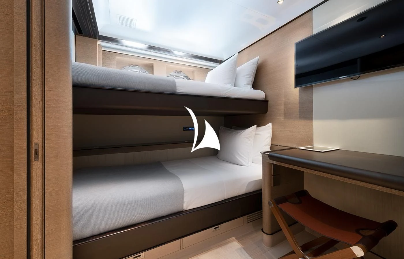 a bed with a white pillow aboard ASAHI Yacht for Sale