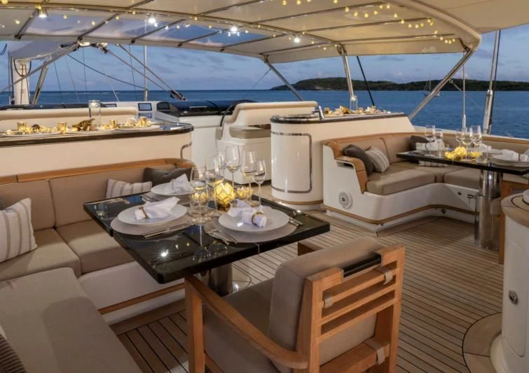 a room with a table and chairs aboard ASAHI Yacht for Sale
