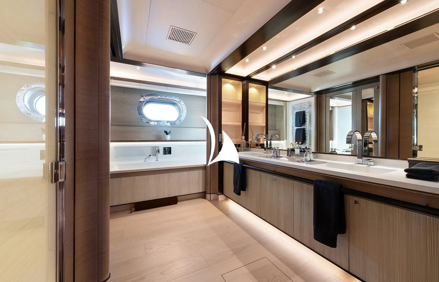 a bathroom with a large mirror aboard ASAHI Yacht for Sale