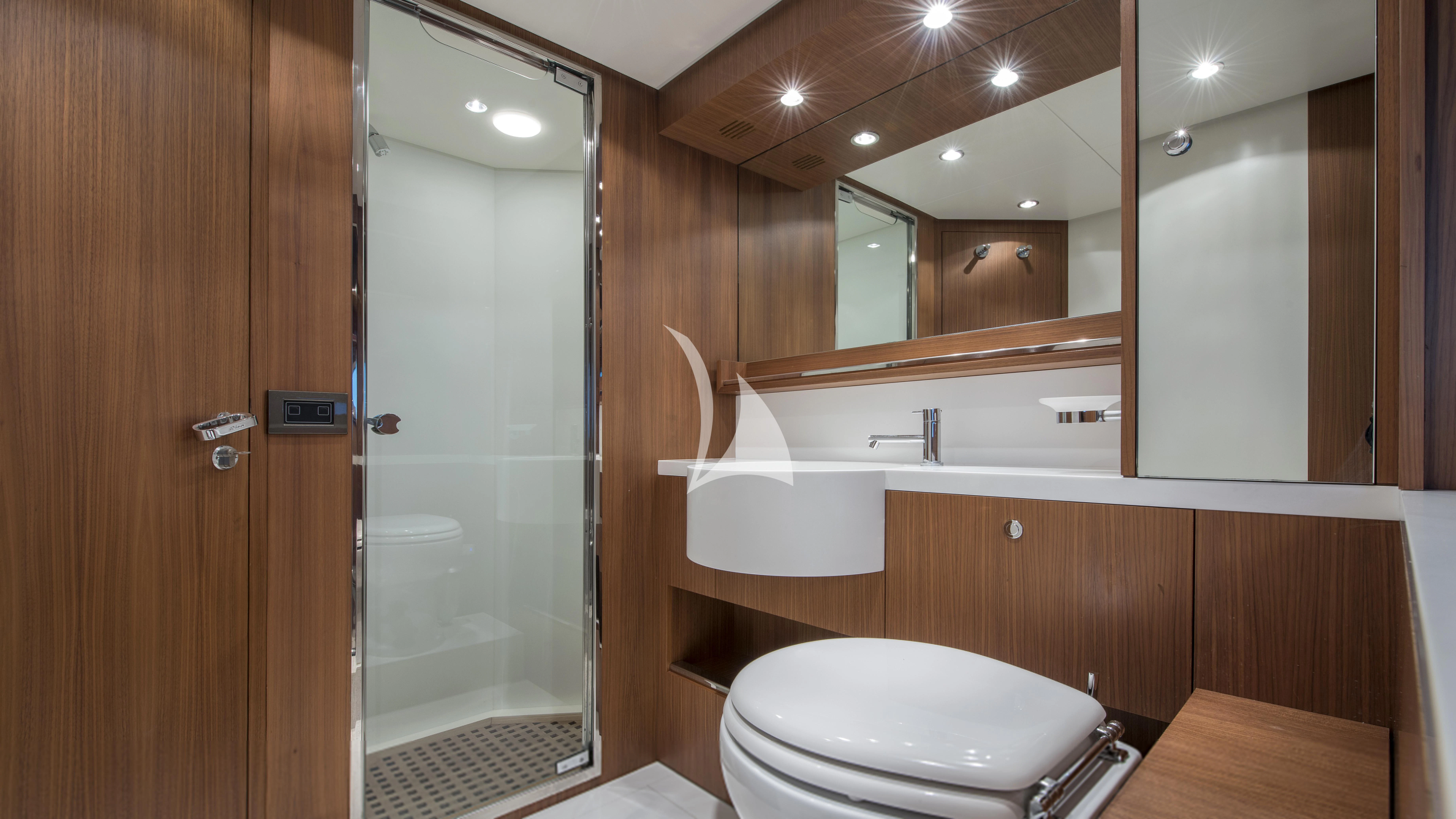 a bathroom with a glass shower aboard ANYTHING GOES IV Yacht for Sale