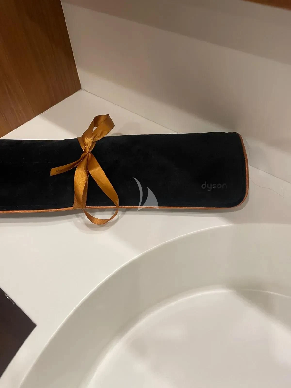 a black wallet with a gold bow aboard ANYTHING GOES IV Yacht for Sale