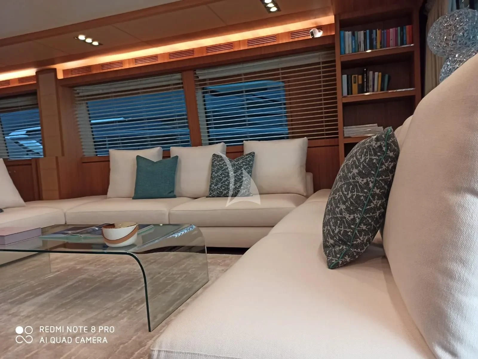 a living room with a couch and a coffee table aboard ANYTHING GOES IV Yacht for Sale