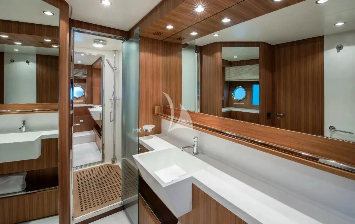 a bathroom with a large mirror aboard ANYTHING GOES IV Yacht for Sale