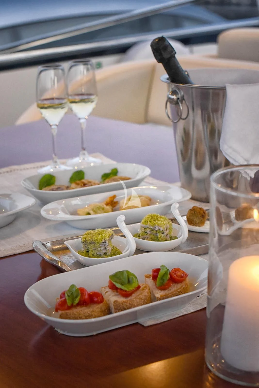a table with food and glasses aboard ANYTHING GOES IV Yacht for Sale