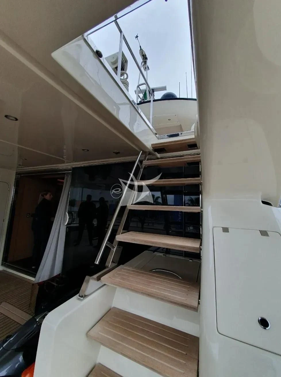 a person standing on a ladder aboard ANYTHING GOES IV Yacht for Sale