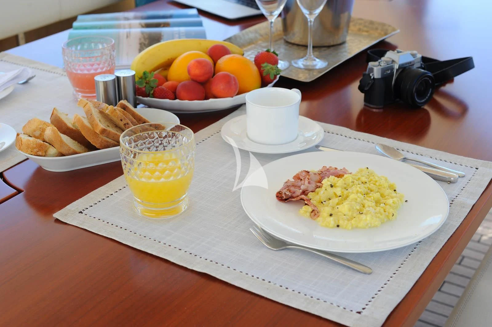 a table with plates of food and glasses on it aboard ANYTHING GOES IV Yacht for Sale