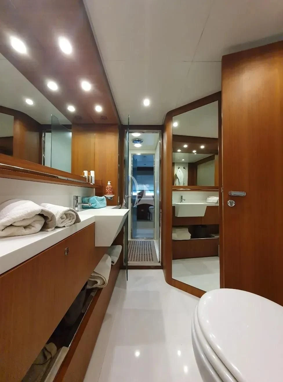 a bathroom with a large mirror aboard ANYTHING GOES IV Yacht for Sale