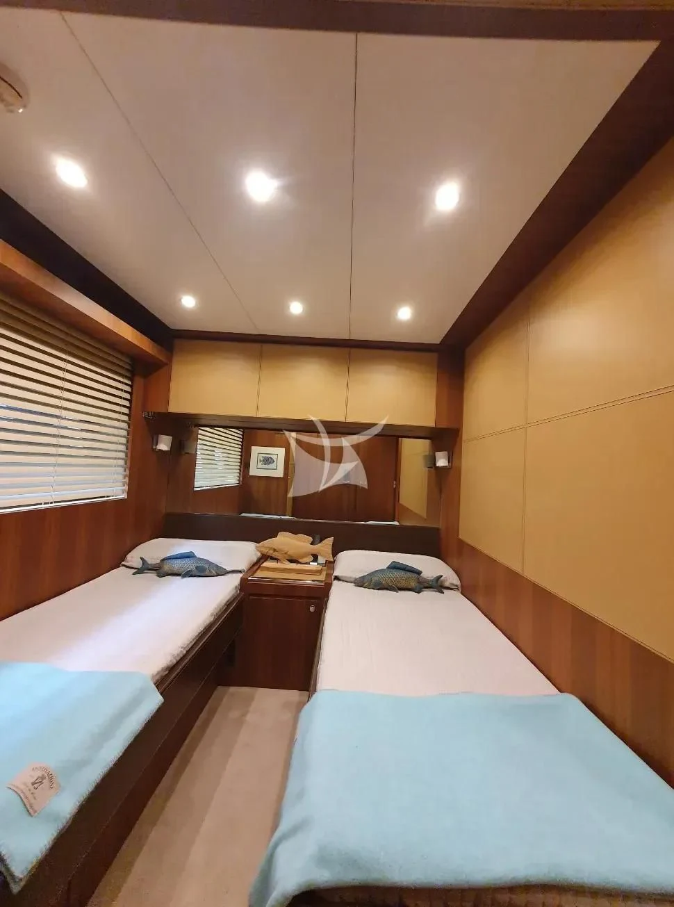 a room with beds and a mirror aboard ANYTHING GOES IV Yacht for Sale