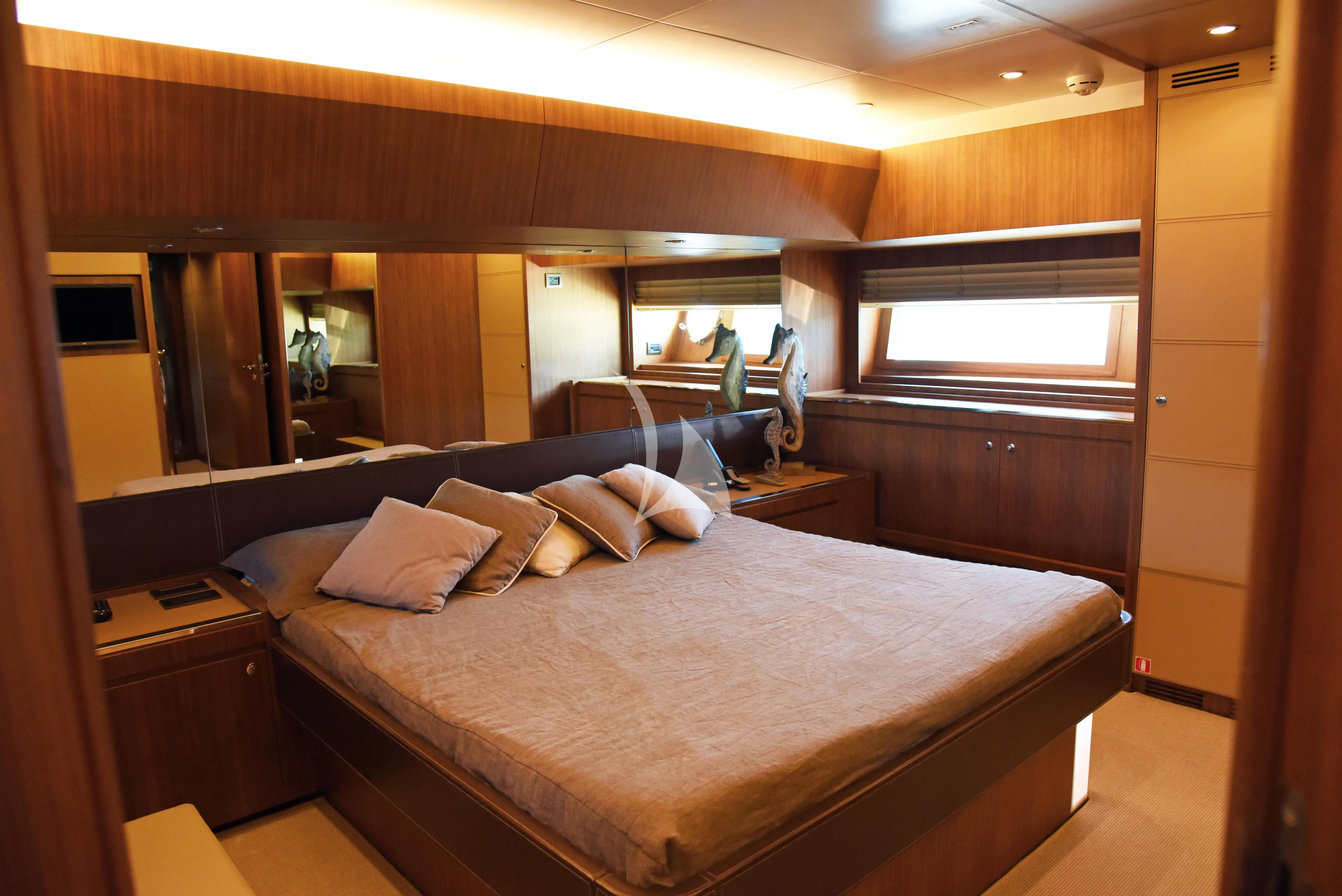a bed with pillows aboard ANYTHING GOES IV Yacht for Sale