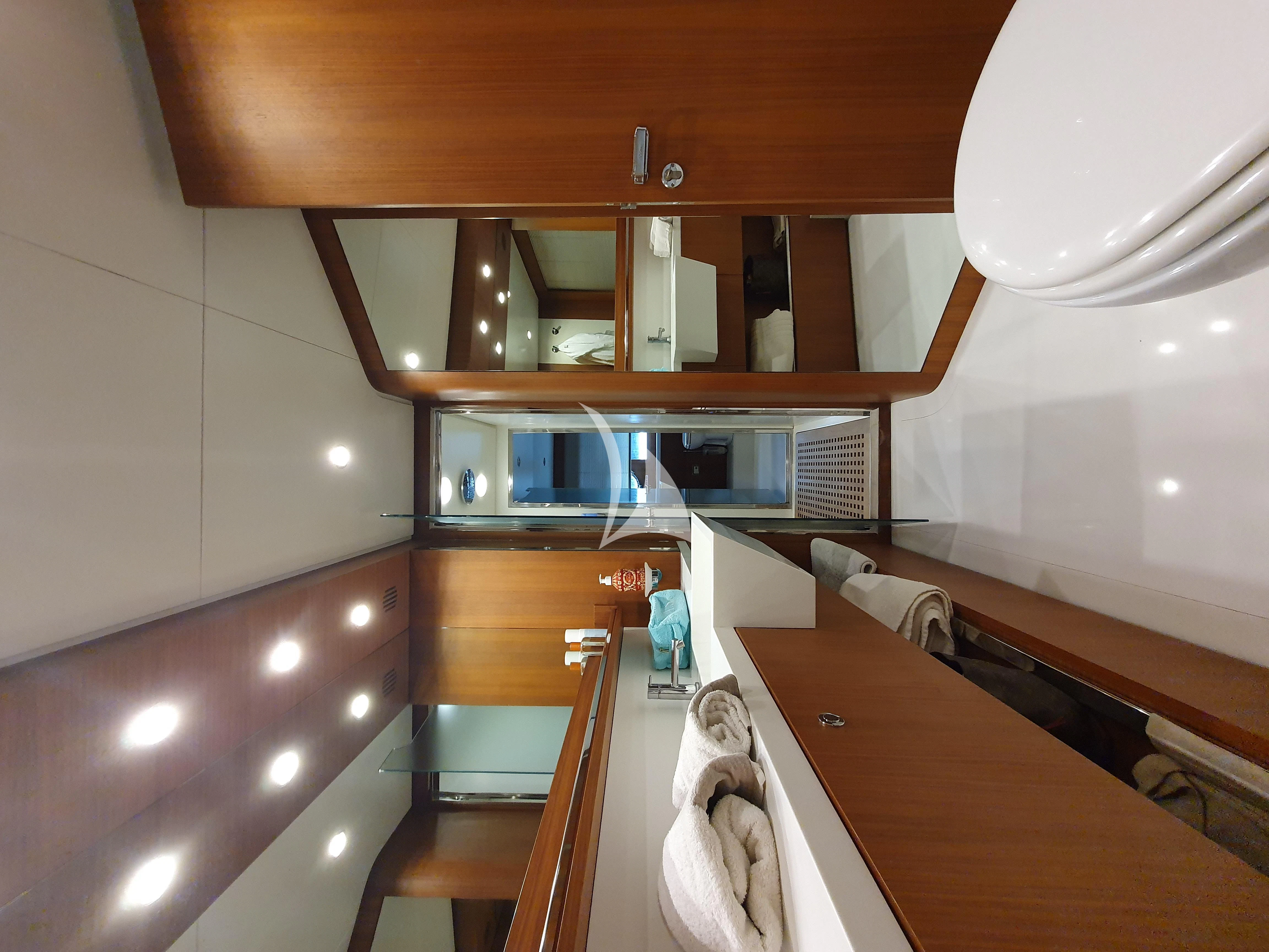 a bathroom with a sink and a mirror aboard ANYTHING GOES IV Yacht for Sale