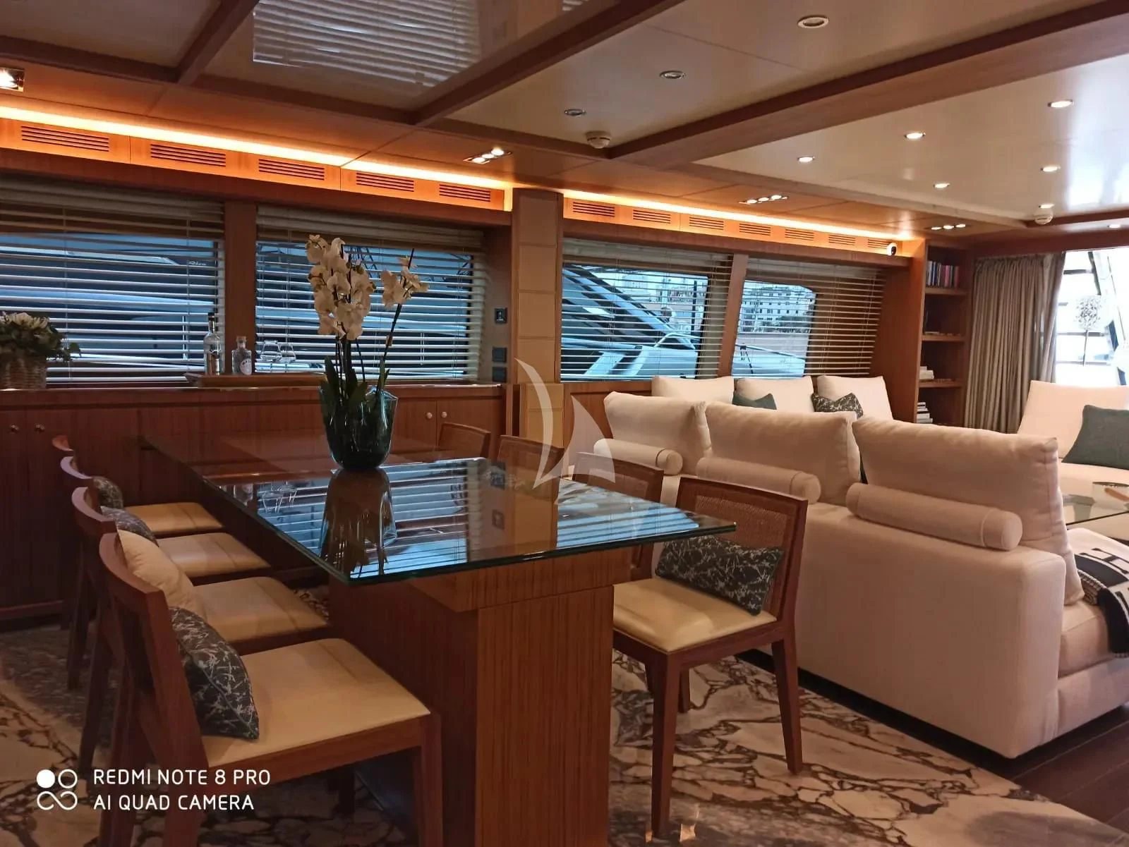 a living room with a table and chairs aboard ANYTHING GOES IV Yacht for Sale