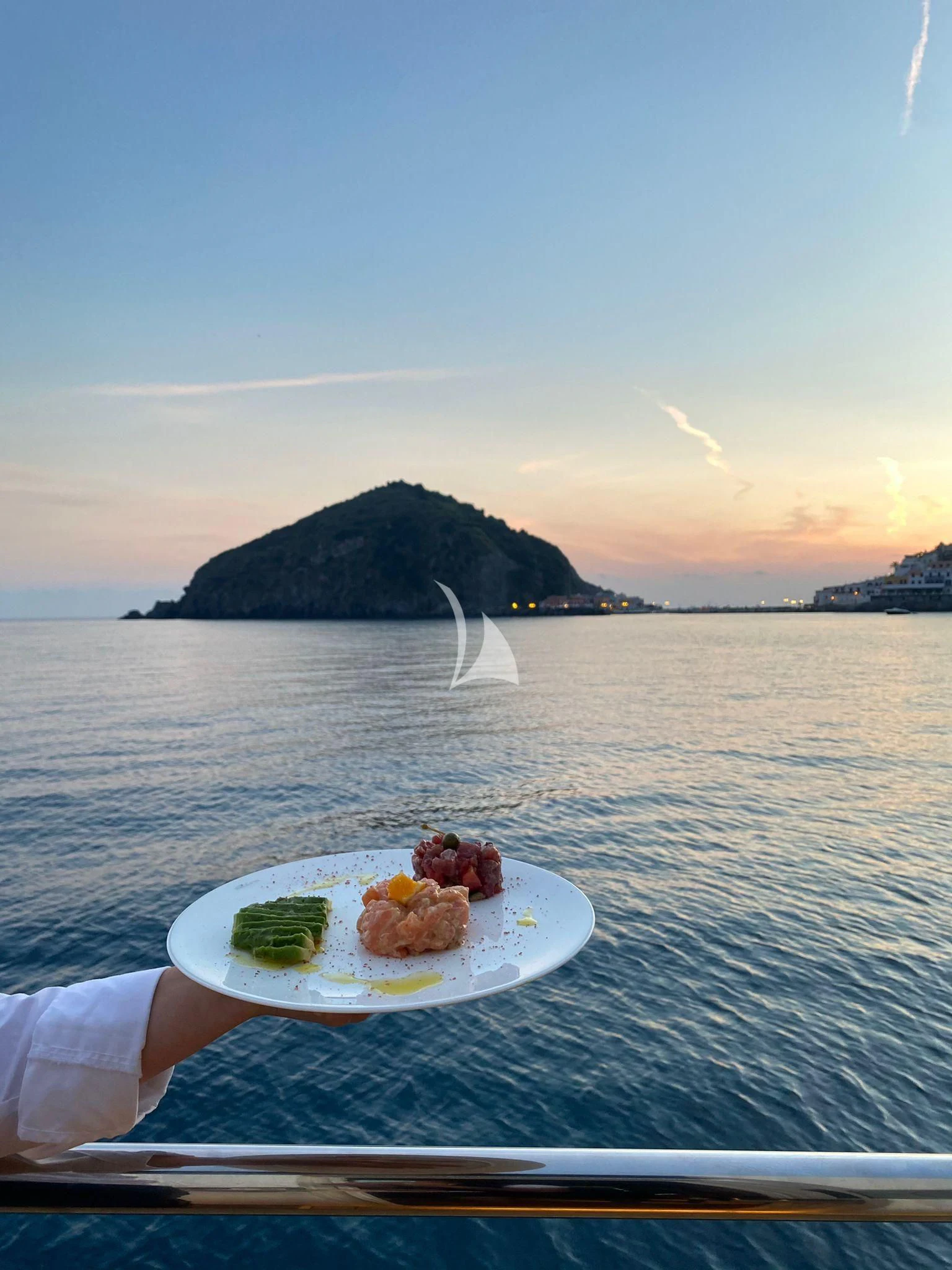 a plate of food on a boat aboard ANYTHING GOES IV Yacht for Sale