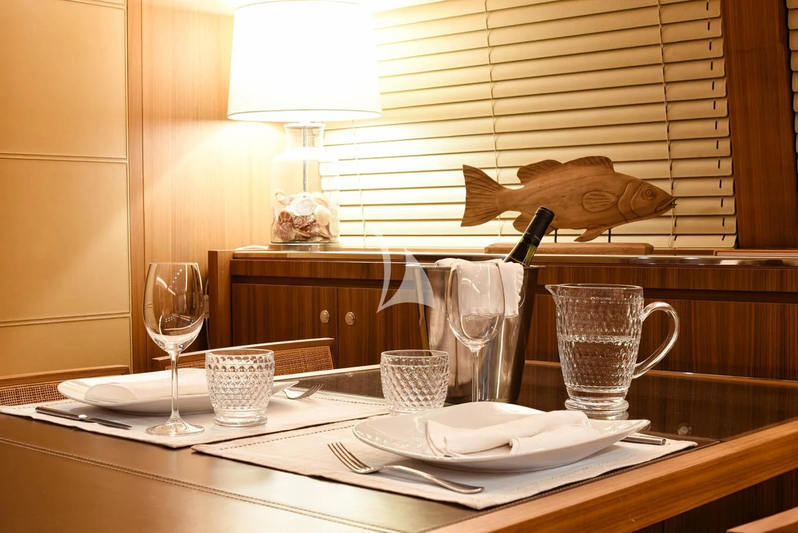 a table with plates and glasses aboard ANYTHING GOES IV Yacht for Sale
