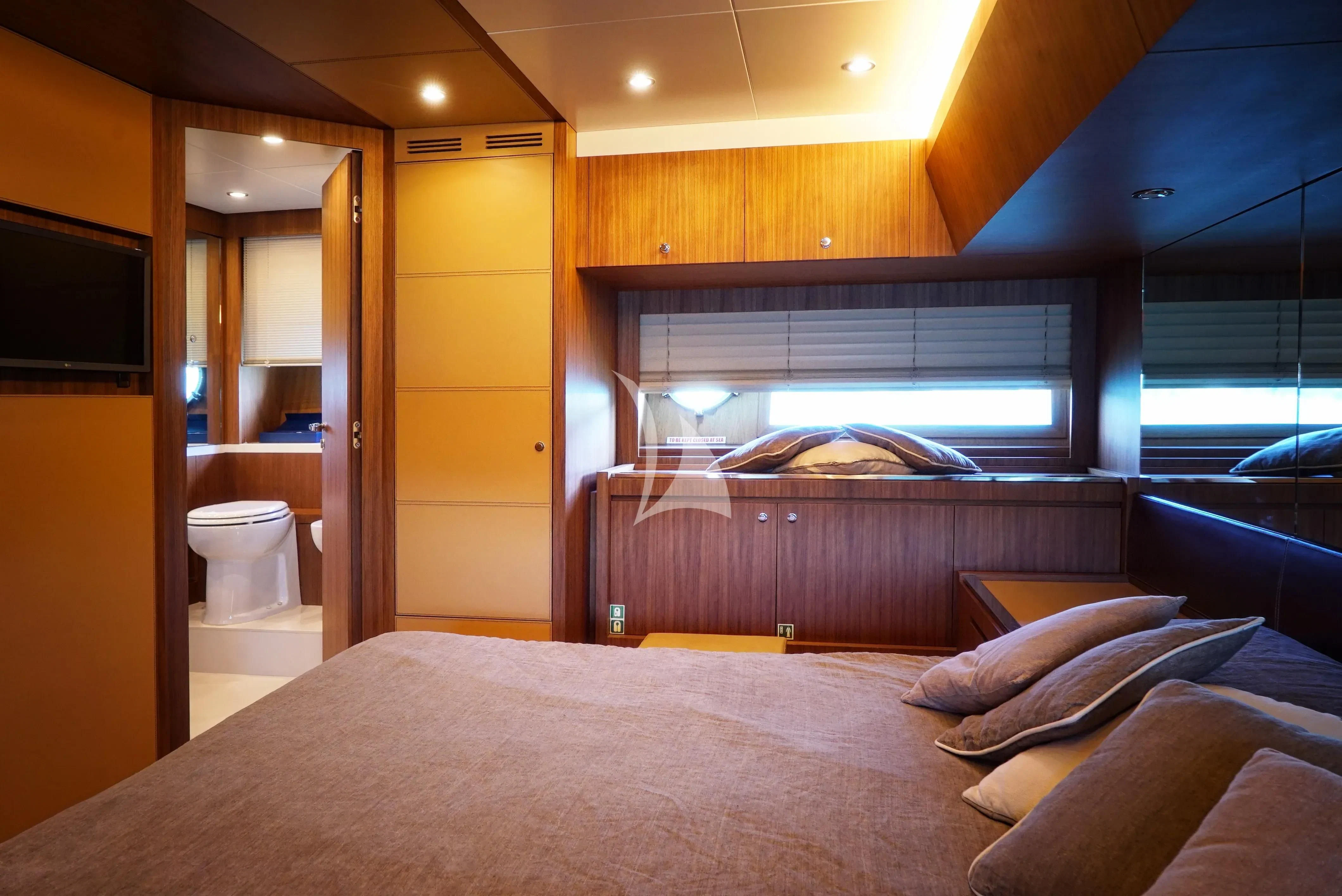 a bed in a room aboard ANYTHING GOES IV Yacht for Sale
