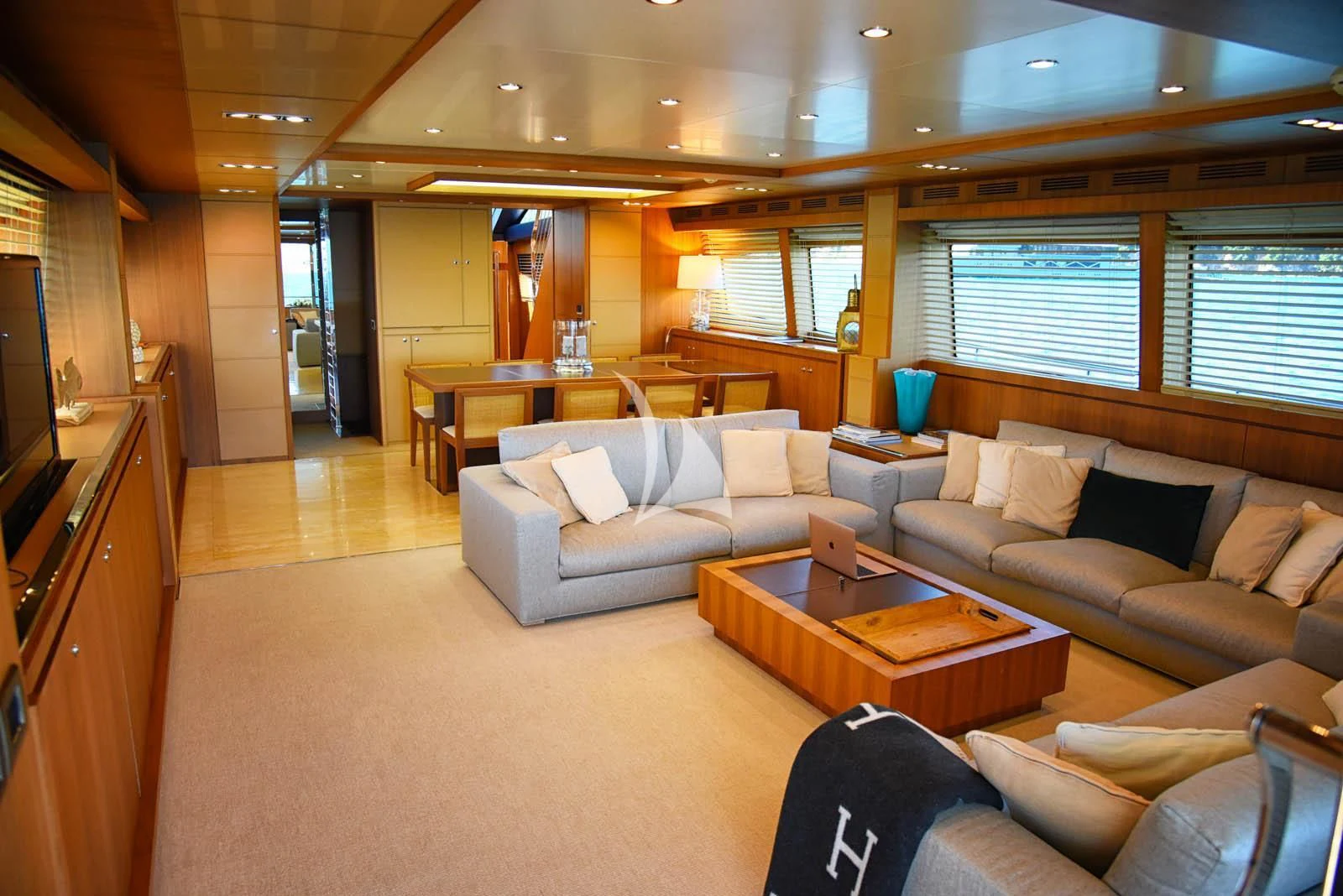 a living room with a couch and a table aboard ANYTHING GOES IV Yacht for Sale