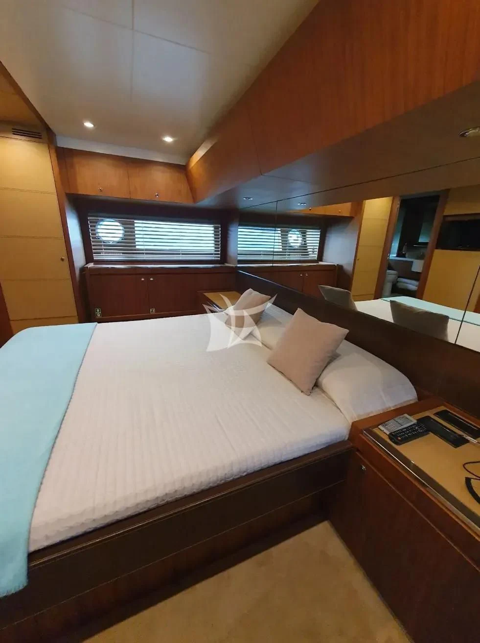 a bed with a white sheet aboard ANYTHING GOES IV Yacht for Sale