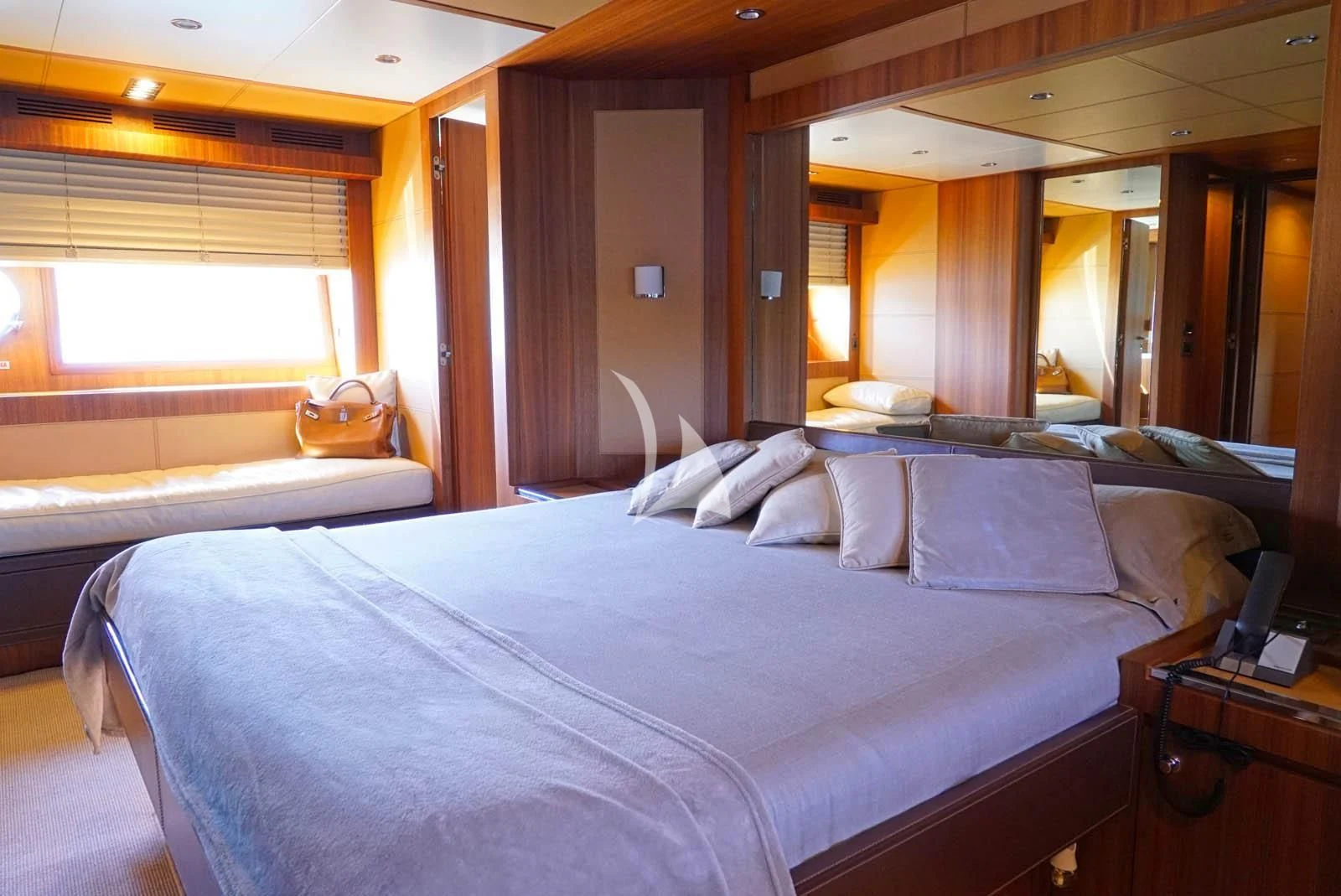 a room with a bed and a window aboard ANYTHING GOES IV Yacht for Sale
