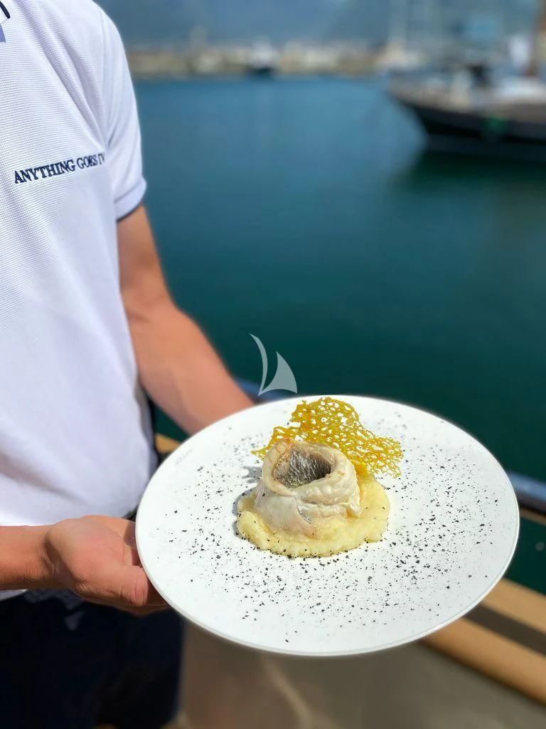 a doughnut on a plate aboard ANYTHING GOES IV Yacht for Sale