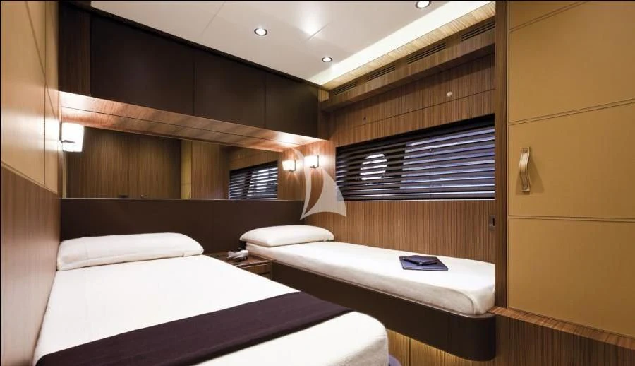 a room with two beds aboard ANYTHING GOES IV Yacht for Sale