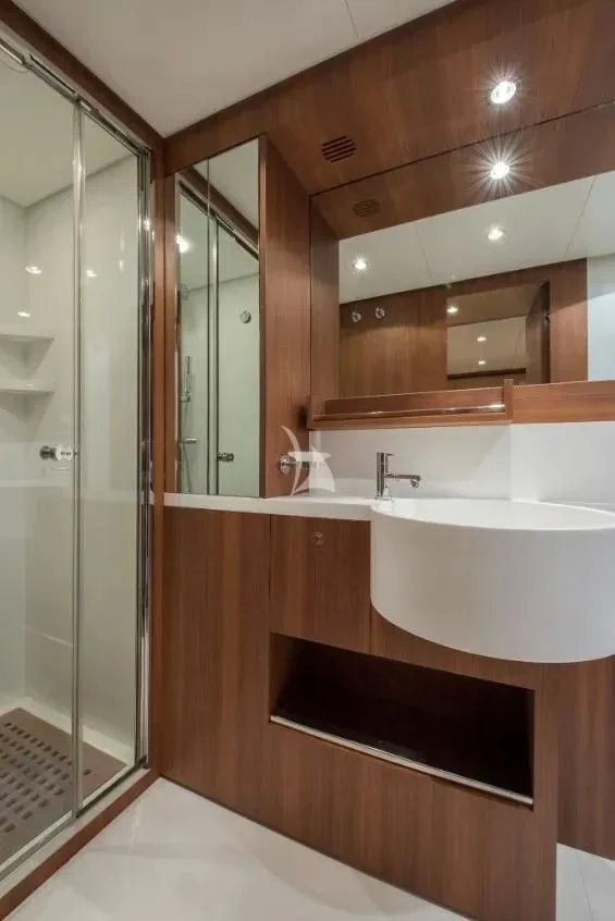 a bathroom with a large mirror aboard ANYTHING GOES IV Yacht for Sale