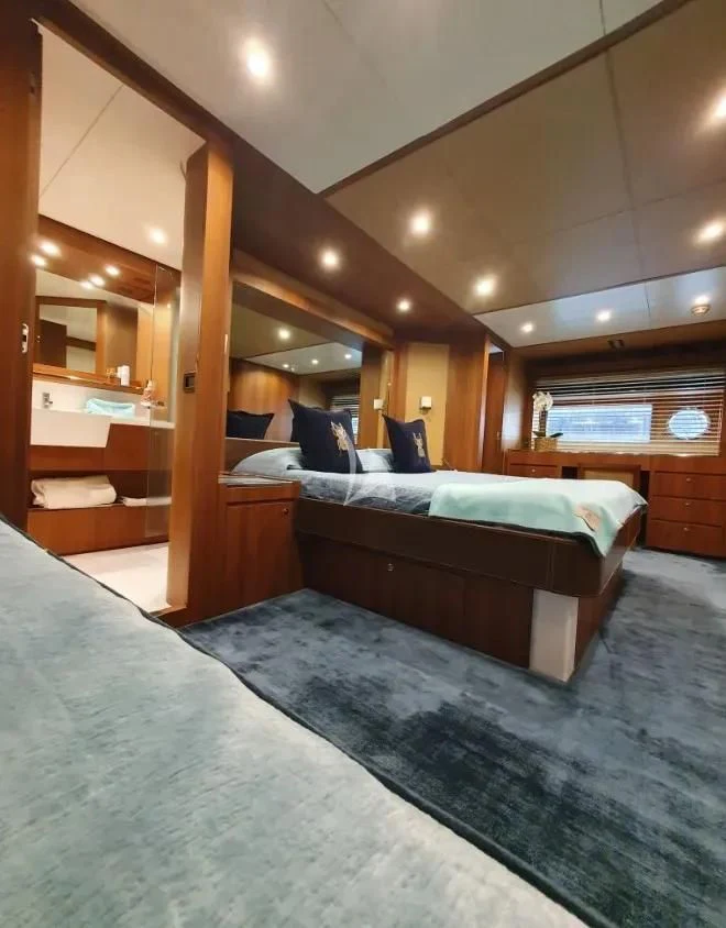a bed in a room aboard ANYTHING GOES IV Yacht for Sale