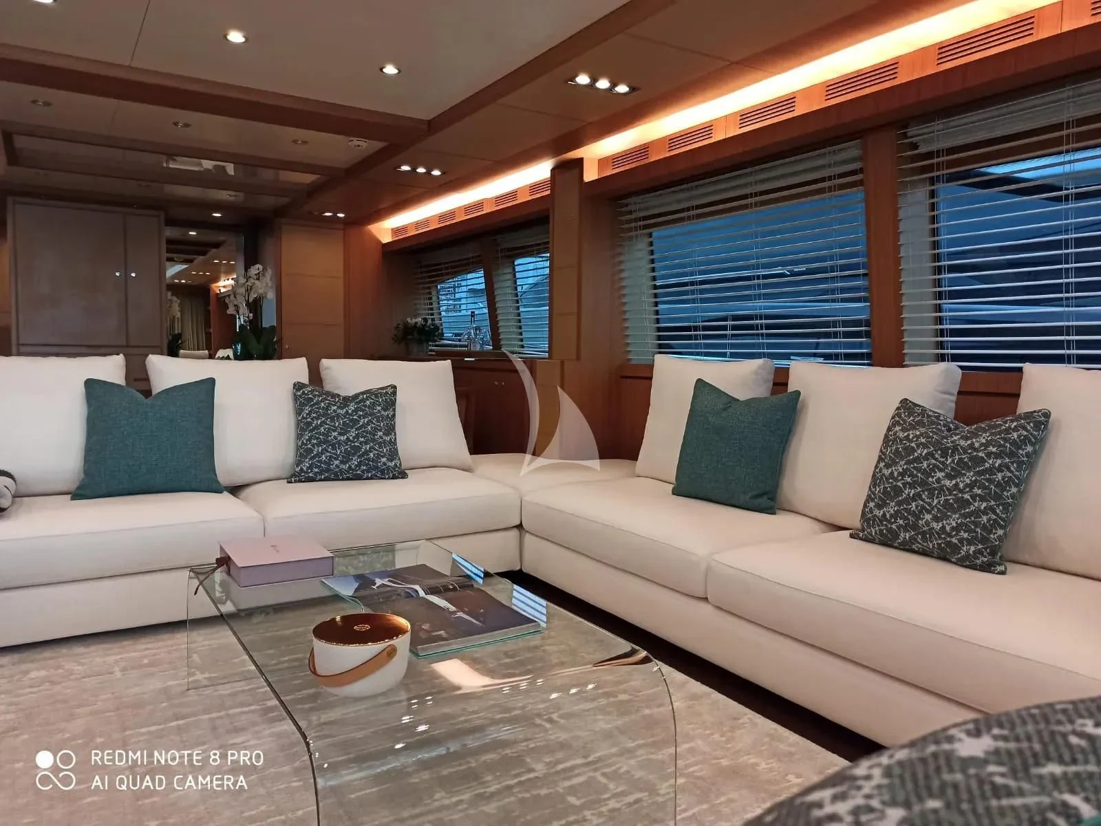 a living room with a couch and a coffee table aboard ANYTHING GOES IV Yacht for Sale