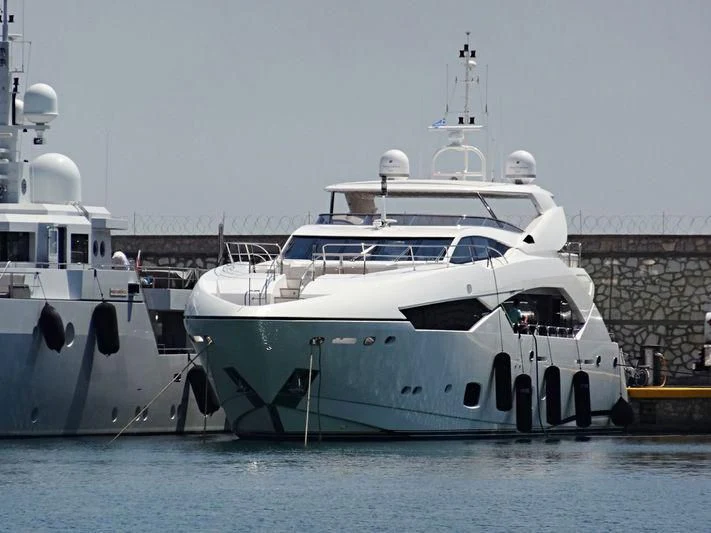 a couple of large boats are parked in the water aboard R2 Yacht for Sale
