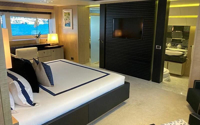 a hotel room with a bed aboard R2 Yacht for Sale