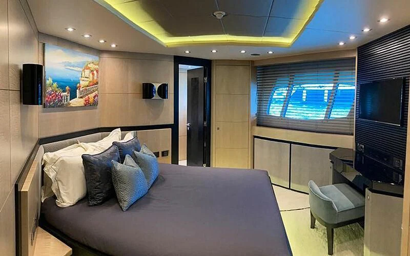a large bed in a room aboard R2 Yacht for Sale