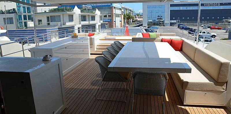 a table with chairs on it aboard LILIYA Yacht for Sale