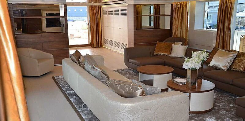 a living room with a couch and coffee table aboard LILIYA Yacht for Sale