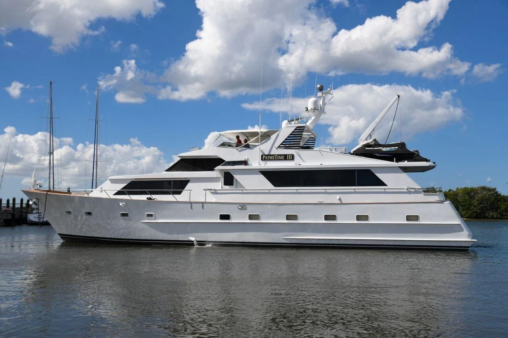 a large white yacht aboard PRIMETIME III Yacht for Sale